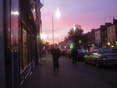Bethnal Green Road at dusk.